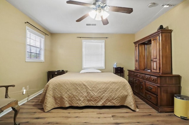 bedroom featuring hardwood / wood-style flooring and ceiling fan