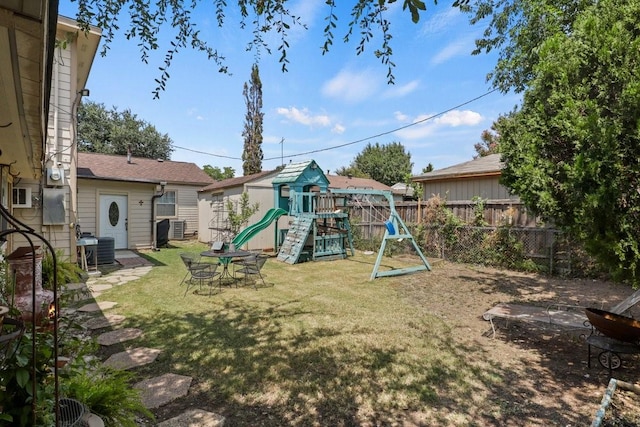 view of play area featuring central AC and a lawn