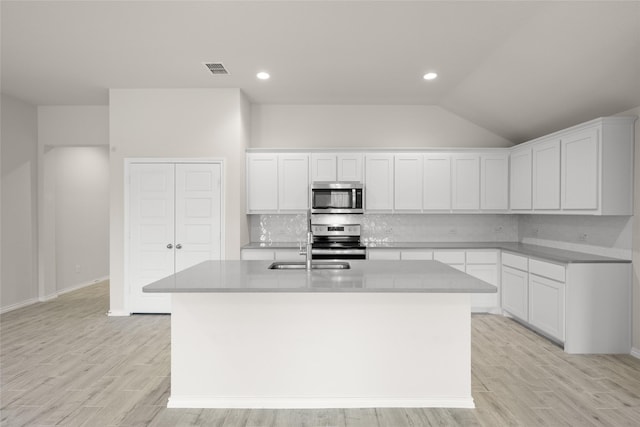 3656 N Crowley Cleburne Rd, Fort Worth, TX 76036 - kitchen featuring white cabinetry, a center island with sink, and appliances with stainless steel finishes