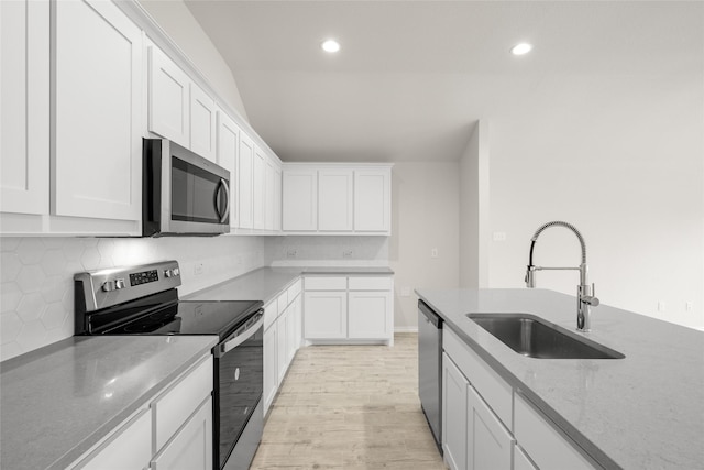 3656 N Crowley Cleburne Rd, Fort Worth, TX 76036 - kitchen featuring white cabinetry, appliances with stainless steel finishes, light stone countertops, and sink