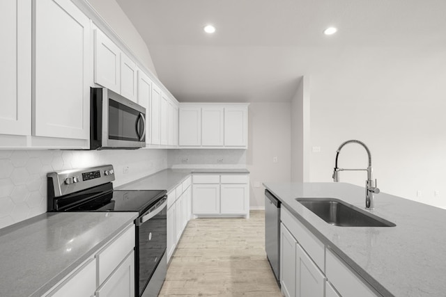 3656 N Crowley Cleburne Rd, Fort Worth, TX 76036 - kitchen with light stone counters, sink, stainless steel appliances, and white cabinets