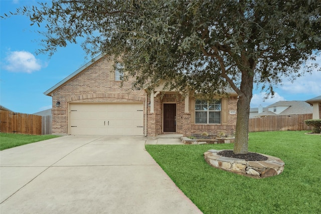 view of front of house with a front lawn and a garage