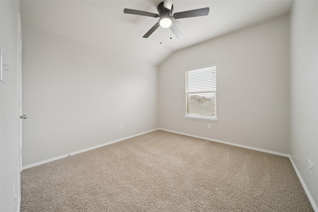 unfurnished room with carpet floors, vaulted ceiling, and ceiling fan