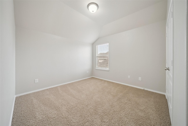 bonus room with lofted ceiling and carpet floors