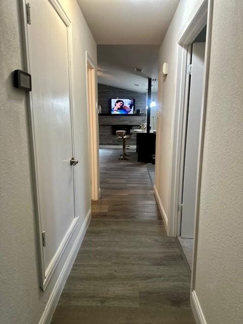 corridor featuring dark hardwood / wood-style floors