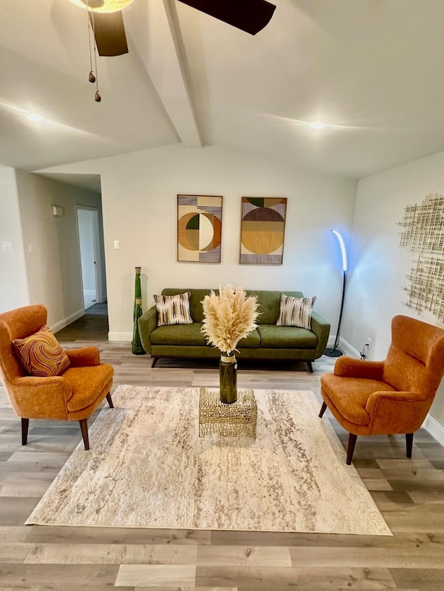 living room featuring hardwood / wood-style flooring and lofted ceiling with beams