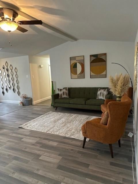 living room with hardwood / wood-style flooring, ceiling fan, and lofted ceiling with beams