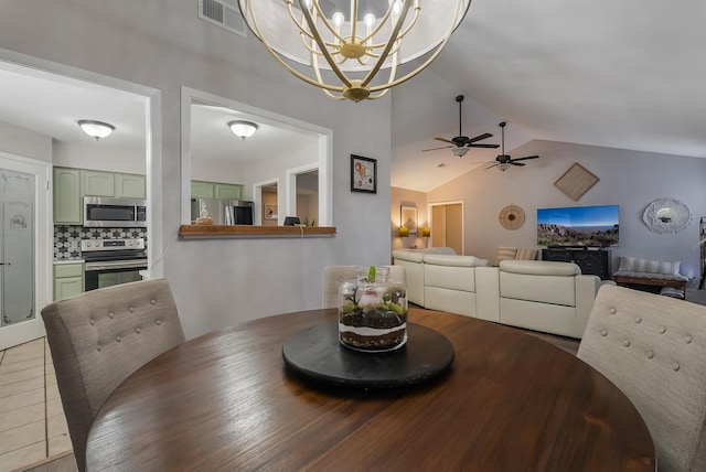 tiled dining space with vaulted ceiling