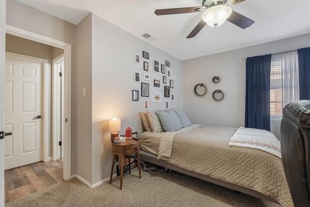 bedroom with ceiling fan and carpet floors