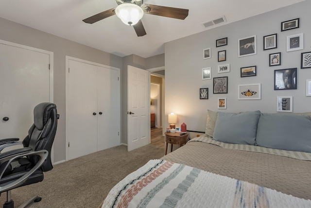 carpeted bedroom with ceiling fan and a closet