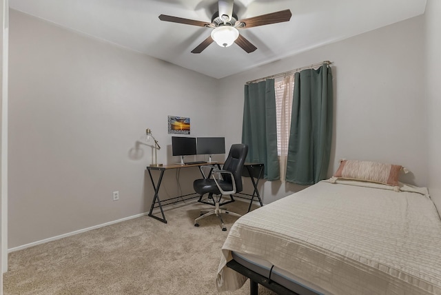 bedroom featuring ceiling fan and light carpet