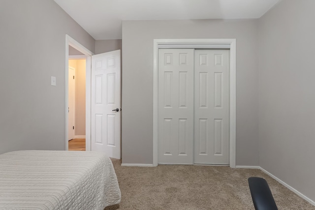 bedroom featuring a closet and carpet flooring