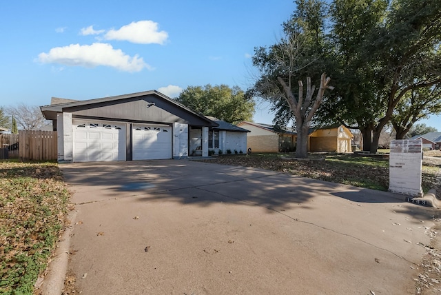 ranch-style home featuring a garage