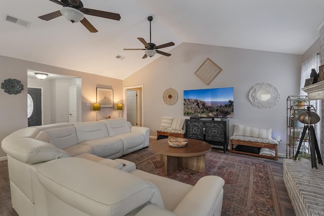 living room featuring dark wood-type flooring and lofted ceiling