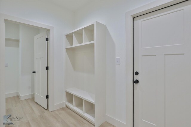 mudroom with light hardwood / wood-style flooring