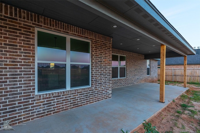 view of patio featuring fence