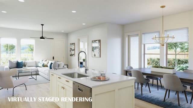 kitchen featuring light hardwood / wood-style floors, decorative light fixtures, a kitchen island with sink, stainless steel dishwasher, and sink