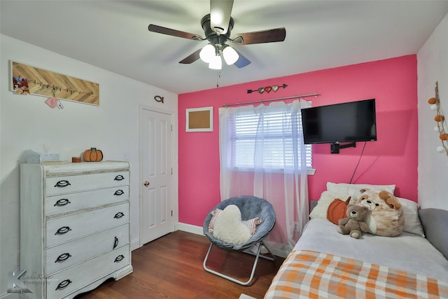 bedroom featuring ceiling fan and dark hardwood / wood-style floors