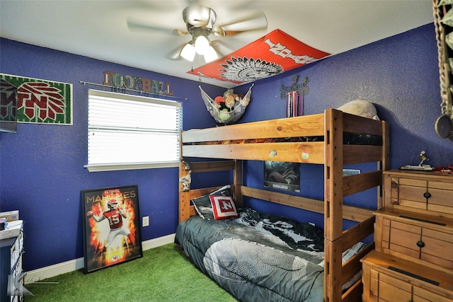 bedroom with ceiling fan and carpet floors