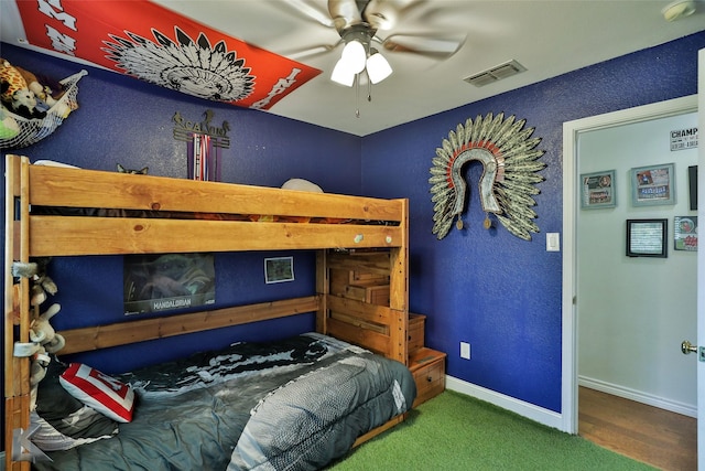 carpeted bedroom featuring ceiling fan