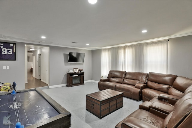 living room with a wealth of natural light and crown molding