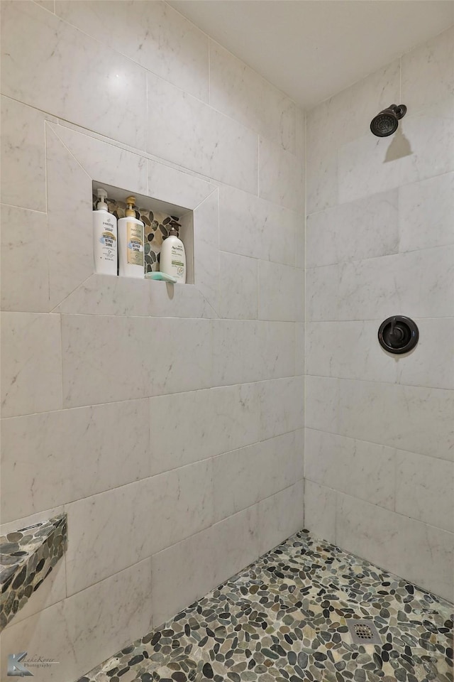 bathroom with tiled shower