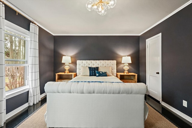 bedroom with an inviting chandelier and crown molding