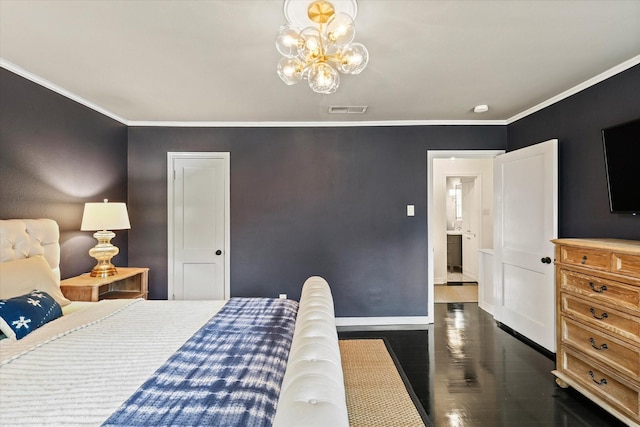 bedroom featuring ensuite bathroom, crown molding, dark hardwood / wood-style floors, and a notable chandelier