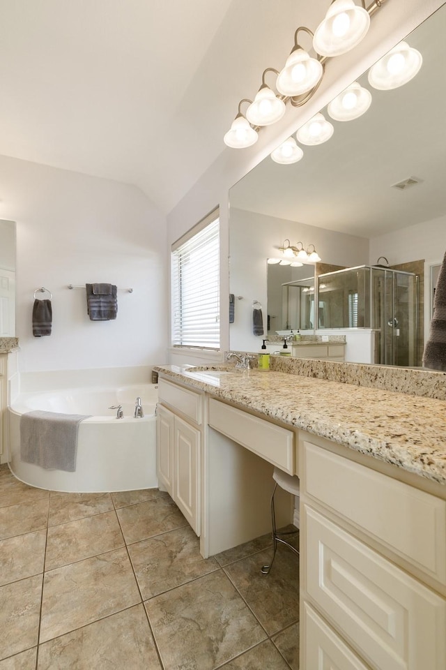 bathroom with vanity, independent shower and bath, and tile patterned flooring