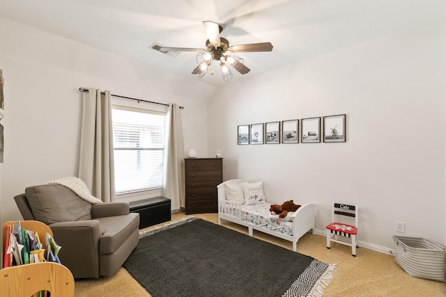 living area featuring ceiling fan, light carpet, and lofted ceiling