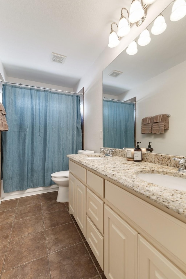 full bathroom with toilet, vanity, and shower / tub combo