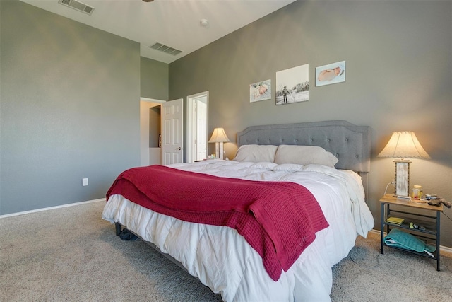 bedroom featuring high vaulted ceiling and carpet