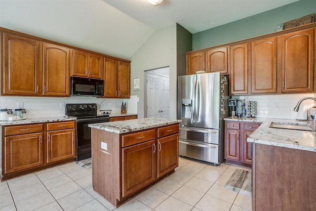 1721 Vista Ridge Dr W, Midlothian, TX 76065 - kitchen featuring black appliances, a sink, tasteful backsplash, light tile patterned floors, and vaulted ceiling