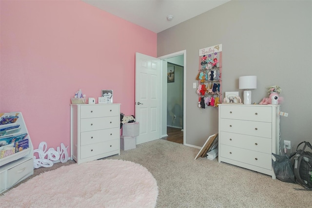 bedroom featuring light colored carpet