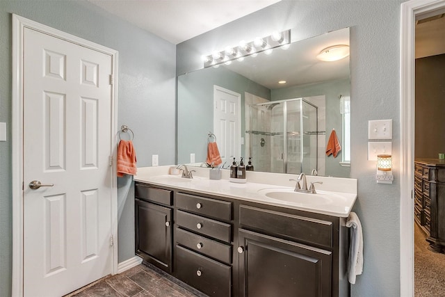 1721 Vista Ridge Dr W, Midlothian, TX 76065 - bathroom with double vanity, a shower stall, and baseboards