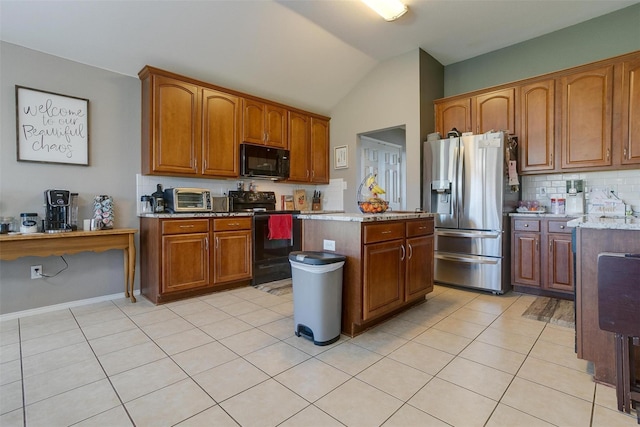 kitchen featuring a kitchen island, lofted ceiling, decorative backsplash, light tile patterned floors, and black appliances