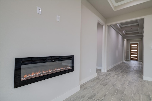 hall with crown molding and light hardwood / wood-style flooring