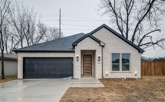 view of front of property with a garage