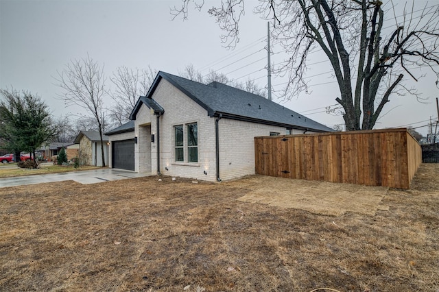 view of property exterior with a garage