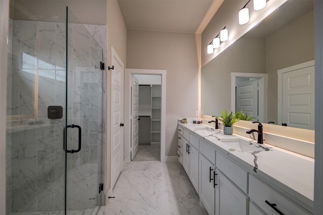 bathroom with walk in shower and vanity