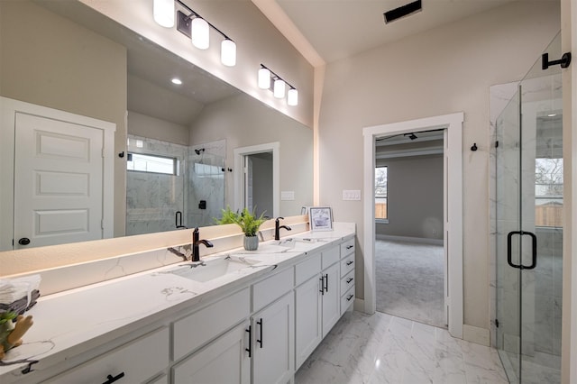 bathroom featuring lofted ceiling, vanity, and an enclosed shower