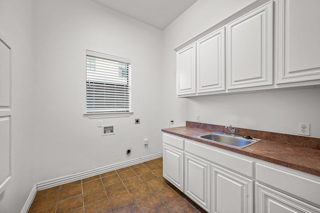 washroom featuring cabinets, sink, hookup for an electric dryer, and washer hookup