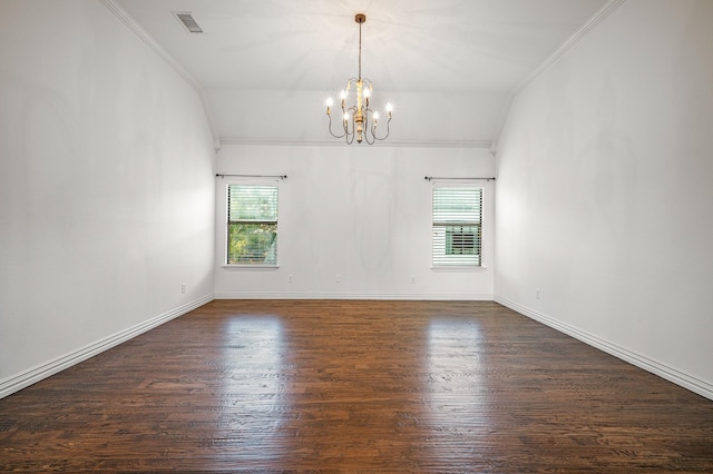 unfurnished room featuring dark wood-type flooring, a healthy amount of sunlight, a notable chandelier, and lofted ceiling