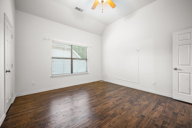 empty room featuring ceiling fan, wood finished floors, visible vents, baseboards, and vaulted ceiling