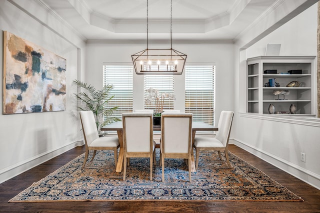 dining area with a raised ceiling, a wealth of natural light, and ornamental molding