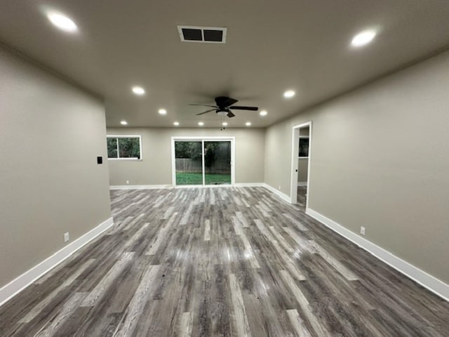 unfurnished room featuring ceiling fan and dark wood-type flooring