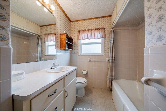 2025 Avenue Ave N, Anson, TX 79501 - full bathroom featuring a textured ceiling, toilet, vanity, and a healthy amount of sunlight