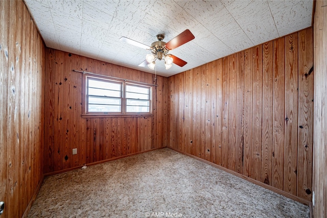 2025 Avenue Ave N, Anson, TX 79501 - unfurnished room featuring ceiling fan and wooden walls