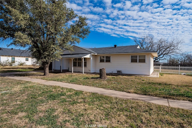 ranch-style house with a front lawn and central AC unit