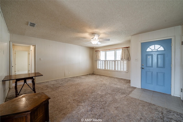 2025 Avenue Ave N, Anson, TX 79501 - entryway with light carpet, ceiling fan, and a textured ceiling